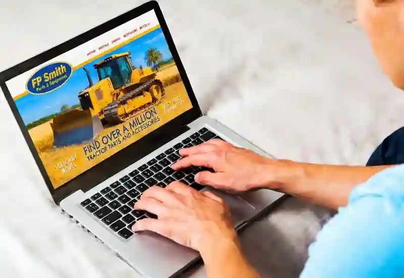 Search Parts - person using laptop on FP Smith website